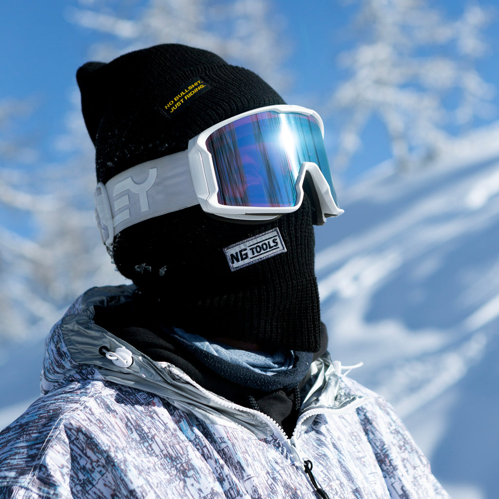 Stay warm and visible with the NGtools Reflective Balaclava. Perfect for snowboarding, skiing, and winter sports. Features a reflective logo for low-light conditions. Black Skimask on Snow.