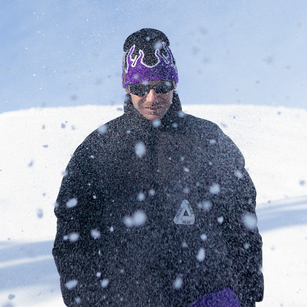 Stay warm and stylish with the NG Graphic Beanie. Featuring bold graphics and our signature 'No Bullshit, Just Riding' label, it's perfect for snowboarding, skiing, and everyday winter wear. 100% acrylic for comfort and durability. Shop now! Purple fire on Snow. Model. Absolut Park. Design.