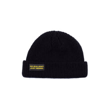 Load image into Gallery viewer, Shop our Kids Classic Beanie—small fit, 100% acrylic, perfect for kids who love snowboarding, skiing, and staying warm. Featuring the &quot;No bullshit, just riding&quot; label, this beanie combines style and warmth for all winter adventures. Ideal winter gear for young shredders! Kids Model. Black Color.