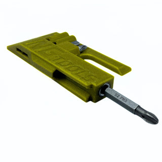 Portable NG Tools Compact Snowboard Tool Multitool Burton EST, designed for snowboard bindings, splitboarding, and wax cleaning, with built-in whistle, displayed on a flat surface.