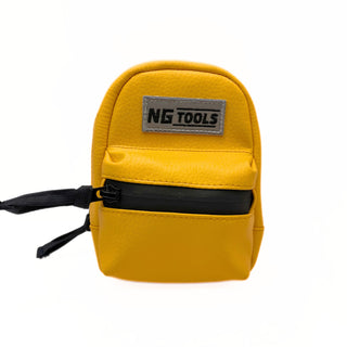 Waterproof yellow NG Snowboard Binding Bag made from durable faux leather, securely attached to a snowboard binding. Ideal for carrying tools, wax, and essentials while riding.