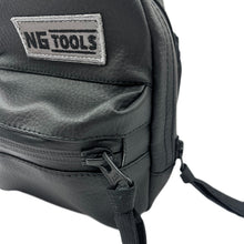 Load image into Gallery viewer, Close-up of NGtools Black Leather binding bag showing textured material, YKK zipper, and compact fit on snowboard gear.
