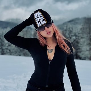 Black snowboard beanie Kamafa graphic on model.