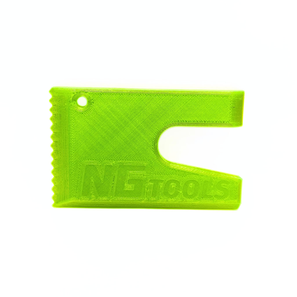 Compact green NG snowboard multitool for snowboarders, essential gear for quick adjustments and repairs on the slopes, lightweight and durable for snowboarding adventures.